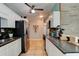 Bright kitchen with white cabinets, stainless steel refrigerator, and decorative wall hanging at 184 Azalea Rd, Edgewater, FL 32141