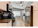 Well-lit kitchen featuring stainless steel appliances, white cabinets, and stone countertops at 184 Azalea Rd, Edgewater, FL 32141