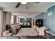 Large and open living space with blue wood paneling and comfortable seating arrangements at 184 Azalea Rd, Edgewater, FL 32141