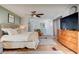 Comfortable main bedroom featuring neutral colors, a ceiling fan, and natural wood accents at 184 Azalea Rd, Edgewater, FL 32141