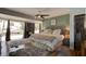 Spacious main bedroom with large windows, hardwood floors, and comfortable furnishings at 184 Azalea Rd, Edgewater, FL 32141