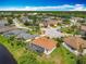Stunning aerial view showcases a waterfront community with lush greenery and beautiful homes at 1840 Tara Marie Ln, Port Orange, FL 32128