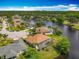 A beautiful aerial view of a waterfront community on a sunny day at 1840 Tara Marie Ln, Port Orange, FL 32128
