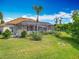 A charming screened lanai overlooks a well-maintained backyard with lush green grass at 1840 Tara Marie Ln, Port Orange, FL 32128
