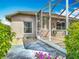 Exterior view of the home's screened lanai and manicured backyard at 1840 Tara Marie Ln, Port Orange, FL 32128