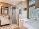 Bathroom featuring a walk-in shower, vanity sink, and jetted tub with glass block window at 1840 Tara Marie Ln, Port Orange, FL 32128