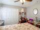 Bedroom with a double door closet, ceiling fan, and a decorative vanity at 1840 Tara Marie Ln, Port Orange, FL 32128