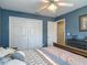 Bedroom with a bed, ceiling fan, large closet, and an adjacent doorway at 1840 Tara Marie Ln, Port Orange, FL 32128