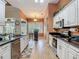 Modern kitchen featuring granite countertops, stainless steel appliances, and white cabinets at 1840 Tara Marie Ln, Port Orange, FL 32128