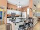 Modern kitchen with white cabinets, stainless steel appliances, and adjacent bar seating area at 1840 Tara Marie Ln, Port Orange, FL 32128
