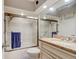 Well-lit bathroom featuring a tub and shower combination, a spacious vanity, and a large mirror at 1903 Sprucewood Way, Port Orange, FL 32128