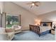 Cozy bedroom with plush carpeting, ceiling fan, a neutral color scheme, and lots of natural light at 1903 Sprucewood Way, Port Orange, FL 32128