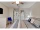 Bedroom boasts coastal-style decor with a queen-sized bed, and a glimpse into an adjacent bathroom at 1903 Sprucewood Way, Port Orange, FL 32128