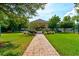 Beautiful community gazebo with lush landscaping and walking path at 1903 Sprucewood Way, Port Orange, FL 32128