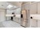 Modern kitchen with stainless steel appliances, white cabinets, and white countertops at 1903 Sprucewood Way, Port Orange, FL 32128