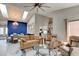 Open-concept living room flows into the kitchen and dining areas under a skylight, creating an airy ambiance at 1903 Sprucewood Way, Port Orange, FL 32128