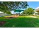 A vibrant playground area with a swing set, slide, and covered seating at 1903 Sprucewood Way, Port Orange, FL 32128