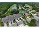 Stunning aerial view of residences near lush green golf course and sparkling ponds at 1903 Turnbull Lakes Dr # 1903, New Smyrna Beach, FL 32168