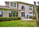 Outdoor patio area offering a relaxing space and a view of the home's exterior and landscaping at 1903 Turnbull Lakes Dr # 1903, New Smyrna Beach, FL 32168