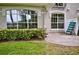 Paver patio with lush greenery, perfect for outdoor relaxation and enjoying peaceful views at 1903 Turnbull Lakes Dr # 1903, New Smyrna Beach, FL 32168
