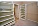Spacious walk-in closet with built-in shelving and ample storage space at 1903 Turnbull Lakes Dr # 1903, New Smyrna Beach, FL 32168