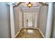 Inviting foyer with tiled flooring, decorative columns, and ample natural light at 1903 Turnbull Lakes Dr # 1903, New Smyrna Beach, FL 32168