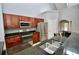 Modern kitchen featuring granite counters, stainless steel appliances, and tile backsplash at 1903 Turnbull Lakes Dr # 1903, New Smyrna Beach, FL 32168