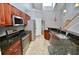 Modern kitchen with stainless steel appliances, granite countertops, and ample cabinet space at 1903 Turnbull Lakes Dr # 1903, New Smyrna Beach, FL 32168