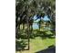 Scenic lake view from the property with lush greenery and trees around the lake at 1903 Turnbull Lakes Dr # 1903, New Smyrna Beach, FL 32168