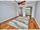 Open living room featuring hardwood floors, stylish ceiling fan, and decorative archways at 1903 Turnbull Lakes Dr # 1903, New Smyrna Beach, FL 32168