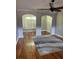 Cozy living room with hardwood floors, rug, and arched doorways to other rooms at 1903 Turnbull Lakes Dr # 1903, New Smyrna Beach, FL 32168
