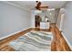 Open living area with hardwood floors, leading to the kitchen with a breakfast bar at 1903 Turnbull Lakes Dr # 1903, New Smyrna Beach, FL 32168