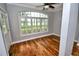 Bright living room with hardwood floors and large window overlooking the garden at 1903 Turnbull Lakes Dr # 1903, New Smyrna Beach, FL 32168