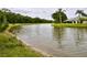 Scenic view of the tranquil pond, providing a relaxing backdrop to the property's landscape at 1903 Turnbull Lakes Dr # 1903, New Smyrna Beach, FL 32168