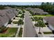 Picturesque street view featuring townhomes, palm trees, and meticulously manicured landscaping at 1903 Turnbull Lakes Dr # 1903, New Smyrna Beach, FL 32168