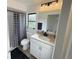 Updated bathroom features a shower-tub combo, vanity, and modern finishes at 208 Wellington Dr, Daytona Beach, FL 32119