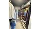 Organized walk-in closet with custom shelving, hanging racks, and a mirror for convenience at 208 Wellington Dr, Daytona Beach, FL 32119