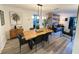 Bright and airy dining space with views into the adjacent living room, creating a seamless flow at 208 Wellington Dr, Daytona Beach, FL 32119