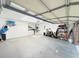 Large garage with modern lighting features an area for laundry and storage at 208 Wellington Dr, Daytona Beach, FL 32119