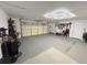 Spacious garage with high ceilings, a storage area, and tool organization system, providing ample space for vehicles and hobbies at 208 Wellington Dr, Daytona Beach, FL 32119