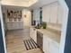 Well-lit kitchen with stainless steel appliances, granite countertops, and white cabinetry at 208 Wellington Dr, Daytona Beach, FL 32119