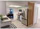 Modern kitchen showcasing stainless steel appliances, a skylight, and a wooden decorative screen at 208 Wellington Dr, Daytona Beach, FL 32119