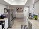 Bright kitchen featuring stainless steel appliances, granite countertops, and an open layout at 208 Wellington Dr, Daytona Beach, FL 32119