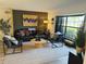 Comfortable living room with stylish seating, natural light, and a decorative area rug at 208 Wellington Dr, Daytona Beach, FL 32119