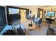 Well-decorated living room with modern furniture, neutral colors, and seamless flow to the dining area at 208 Wellington Dr, Daytona Beach, FL 32119