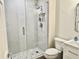 Modern bathroom with a glass-enclosed shower featuring decorative tile and modern fixtures at 2100 N Peninsula Ave # 2160, New Smyrna Beach, FL 32169