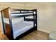 This bedroom has a bunk bed with paneled wood detail at 2100 N Peninsula Ave # 2160, New Smyrna Beach, FL 32169