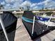 View of a boat dock that contains a boat lift for two boats at 2100 N Peninsula Ave # 2160, New Smyrna Beach, FL 32169