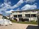 Condo with balcony overlooking lush landscaping, offering a tranquil outdoor living space at 2100 N Peninsula Ave # 2160, New Smyrna Beach, FL 32169