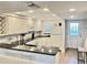 Bright kitchen with white cabinets, modern appliances, and a breakfast bar for casual dining at 2100 N Peninsula Ave # 2160, New Smyrna Beach, FL 32169